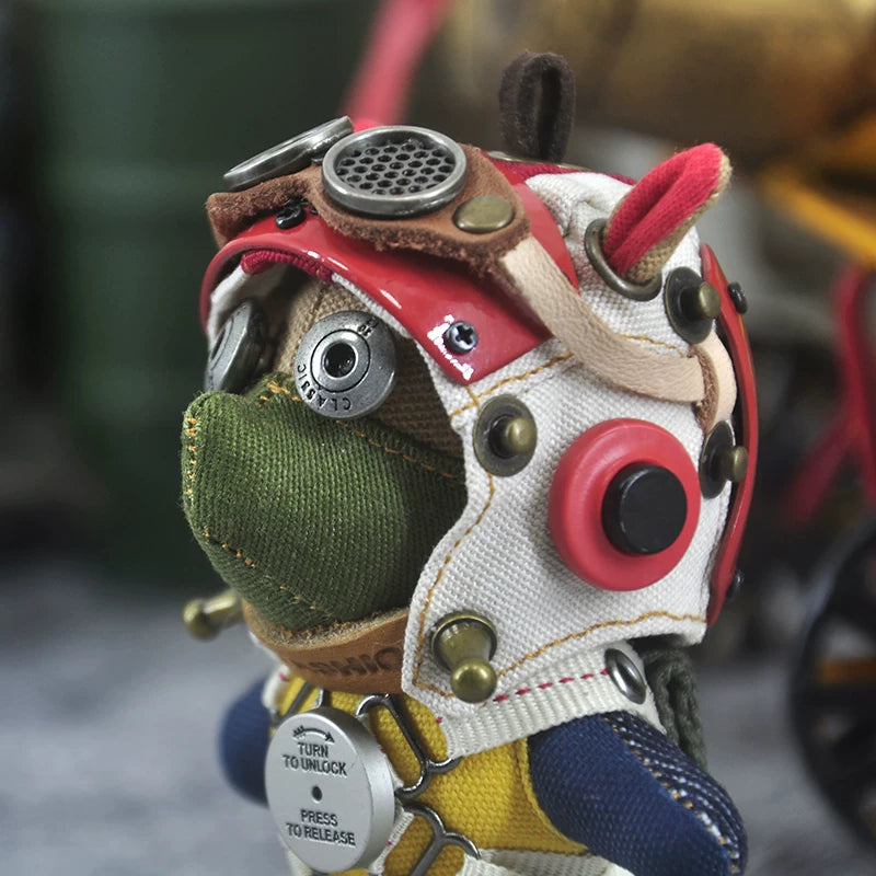 Bunny dog in gothic aviator gear with dark leather jacket and metal goggles. Dark artisan macabre art toy, vintage designer keychain.