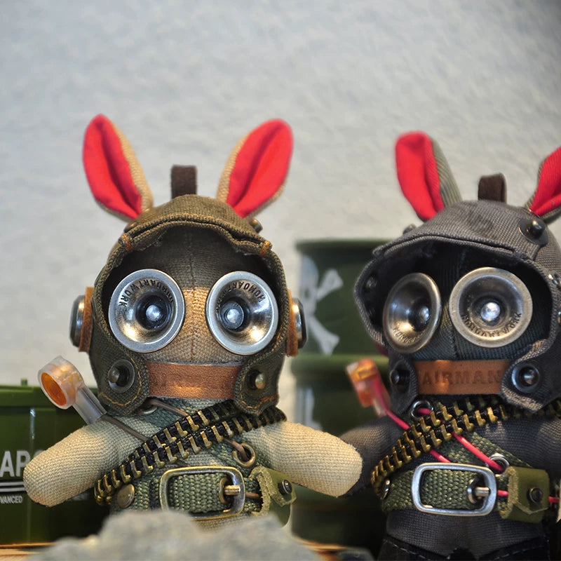 Gothic bunny soldier in dark tactical gear with metal buckles and goggled visor. Dark wasteland aesthetic, artisan art toy, macabre collectible.