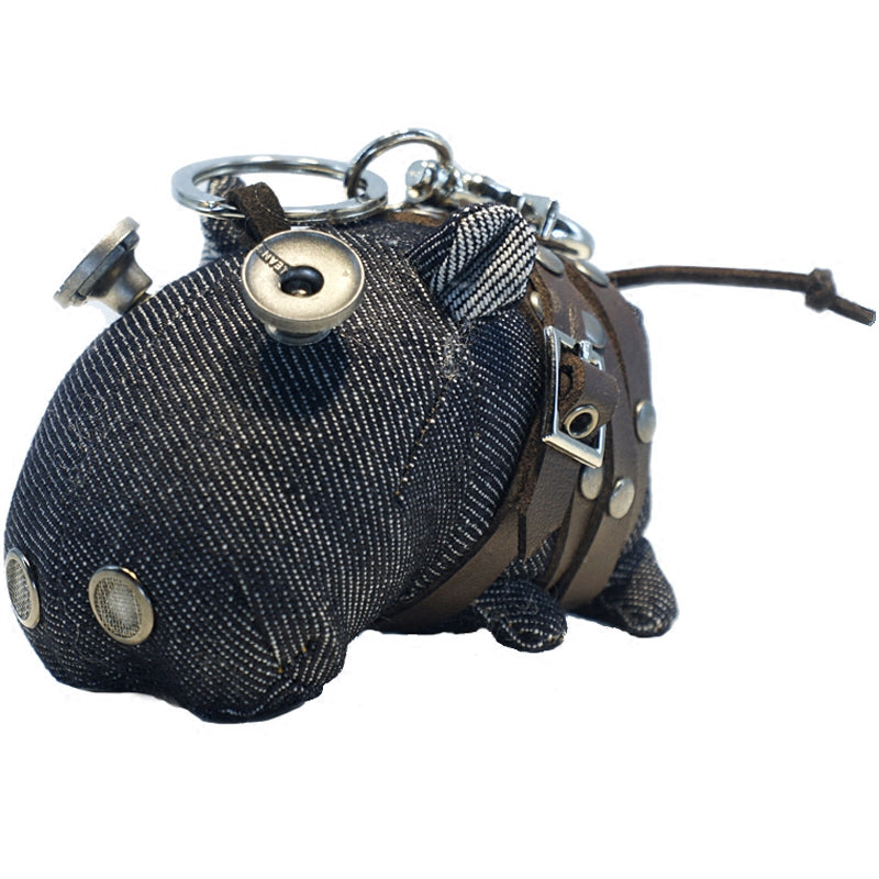 Denim hippo featuring indigo body and weathered brass-tone hardware details. Gothic artisan craft, dark folk art keychain.