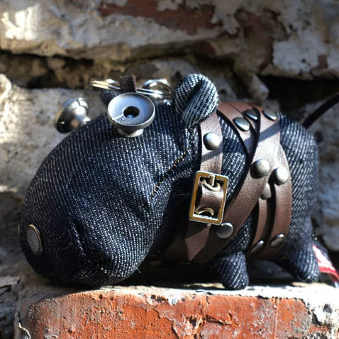 Rustic artisan denim hippo figure with blue-gray fabric and leather tag accent. Gothic folk art style, dark macabre collectible.