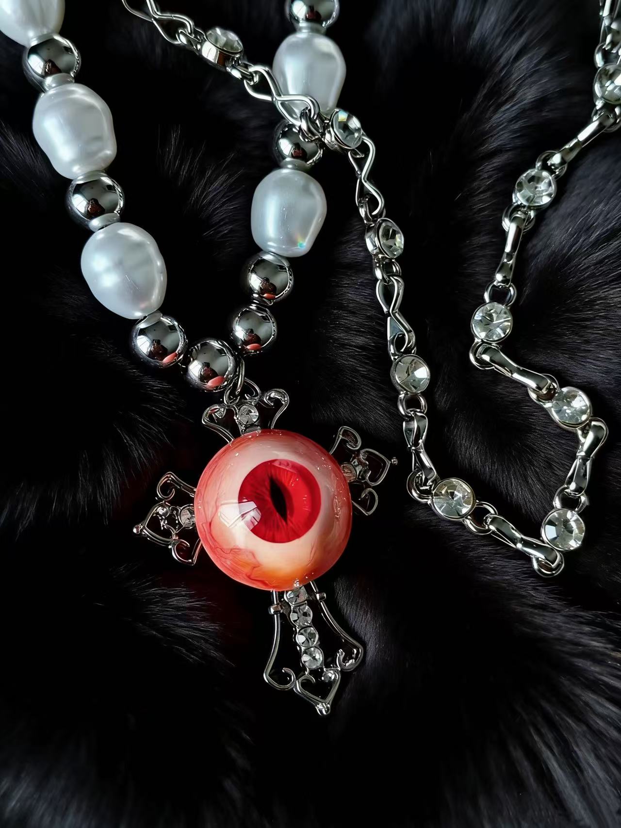 Surreal eyeball pendant necklace gothic jewelry detail shot