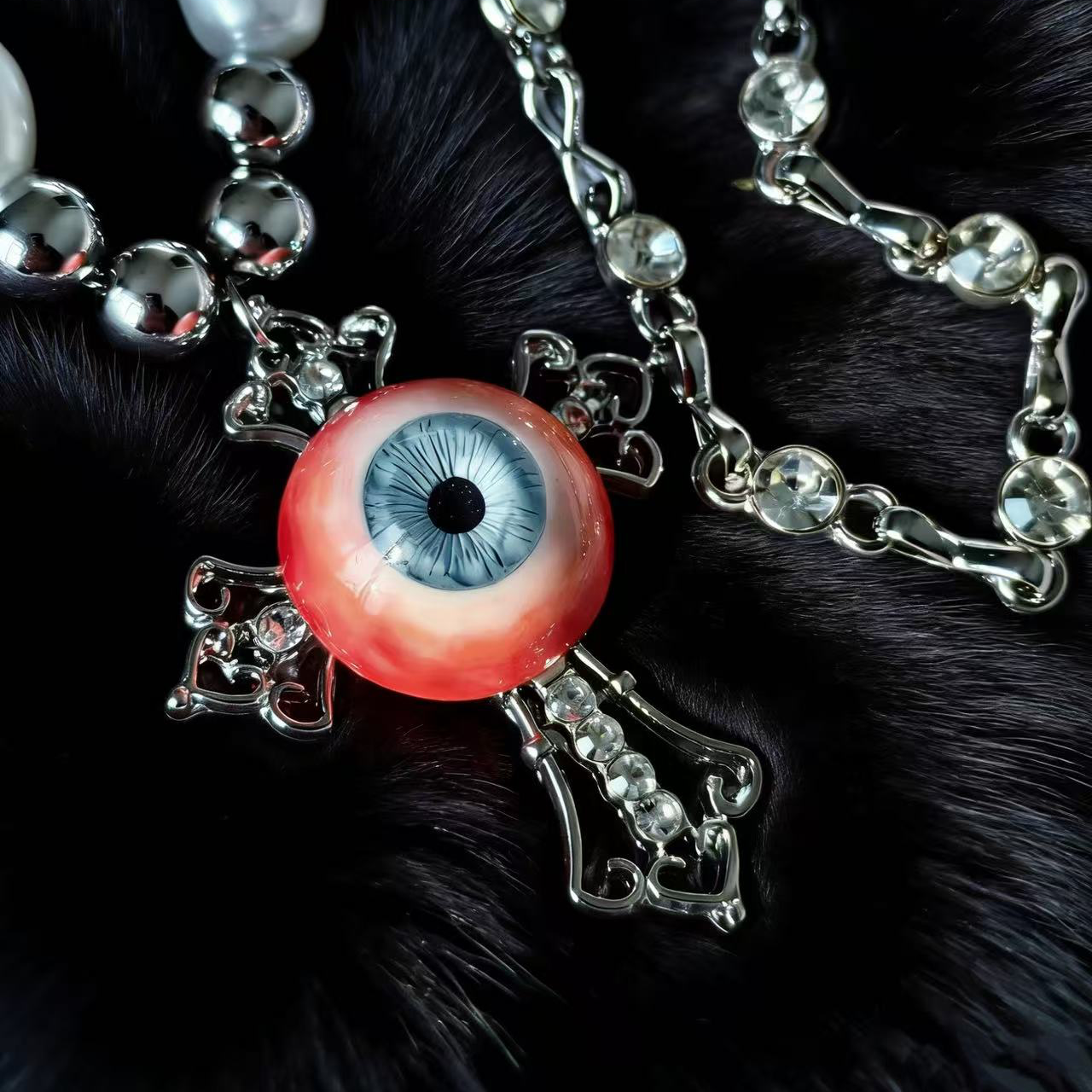 Artistic horror eyeball pendant necklace studio lighting