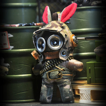 Bunny figure in camouflage tactical gear with military utility harness. Gothic artisan dark art toy, macabre collectible.