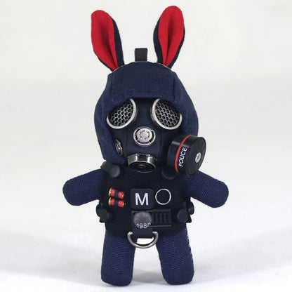 Bunny wearing complex black gas mask with silver filter and dark tactical gear. Gothic artisan macabre art toy, dark collectible.
