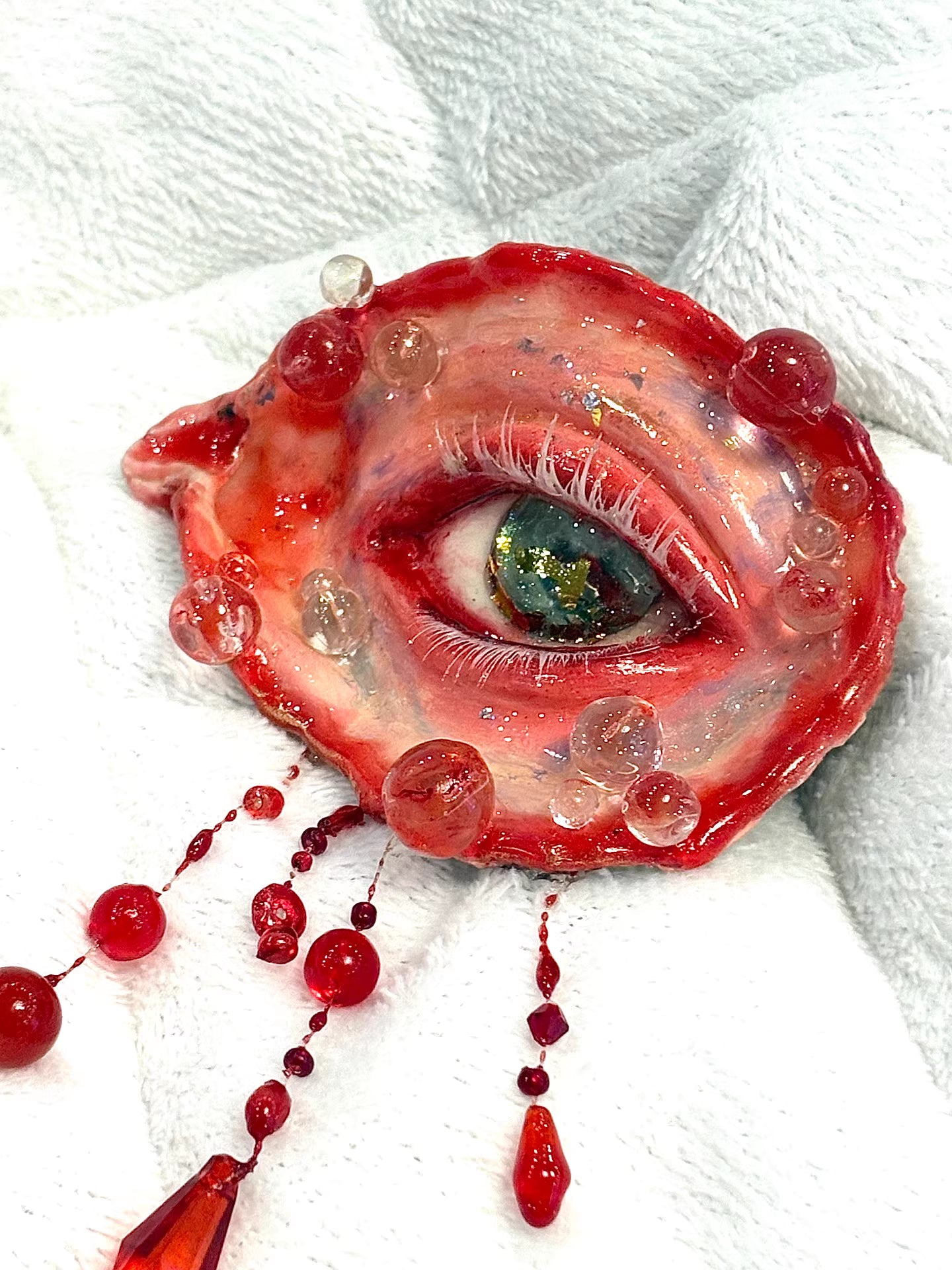 Front view of Bloody Eye gothic decorative figurine in blood-red color