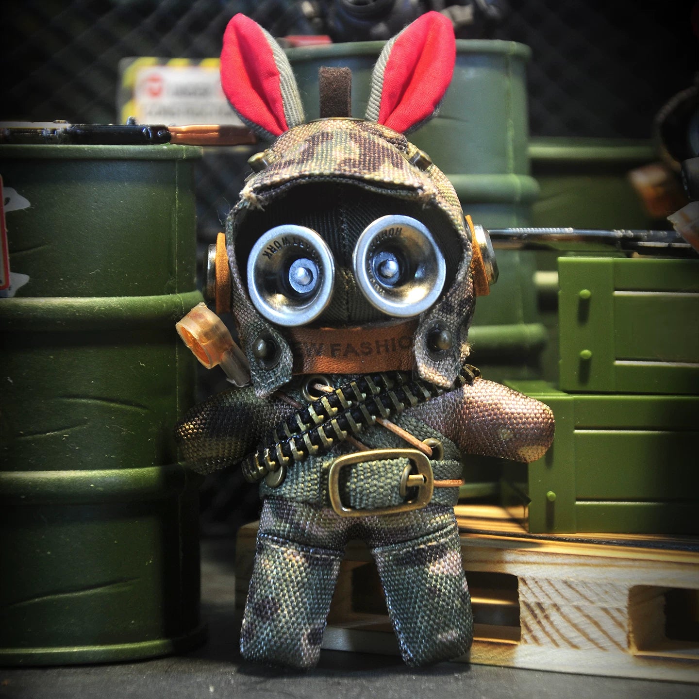 Bunny in dark tactical camo gear with goggled helmet and ammo bandolier. Gothic artisan macabre art toy, dark military collectible.