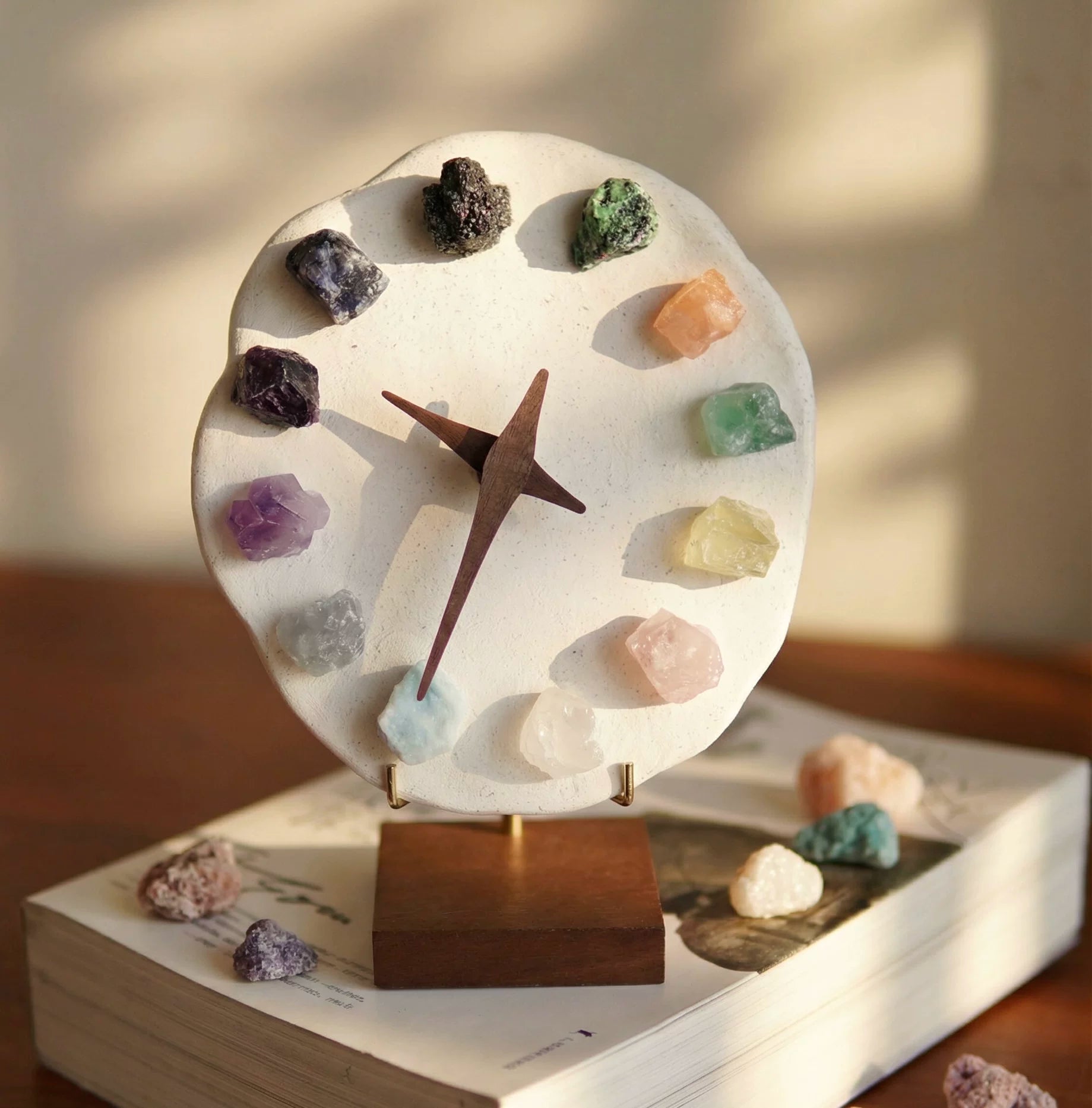 Mineral crystal clock on wooden book base, 12 gemstone hour markers in crystal rainbow colors. Artisan gothic home decor, crystal decor accent piece.