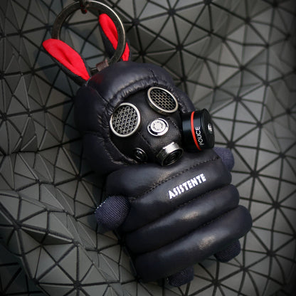 Gothic techwear bunny in gas mask with dark quilted tactical jacket. Dark artisan art toy, macabre designer collectible.
