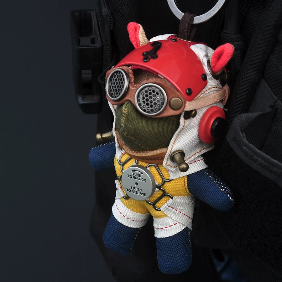 Gothic aviator pilot dog keychain in dark leather jacket with goggles and flight cap. Macabre artisan designer art toy, dark collectible.