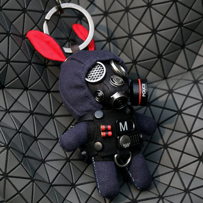 Bunny in black tactical gas mask with silver mesh eyepieces and armored body. Gothic artisan macabre art toy, dark designer collectible.
