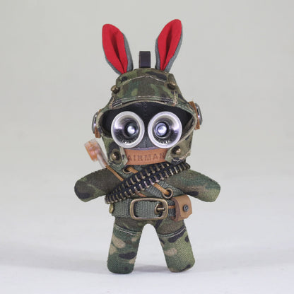 Tactical bunny soldier in dark camo with ammo bandolier and utility belt. Gothic artisan art toy, dark macabre designer keychain.