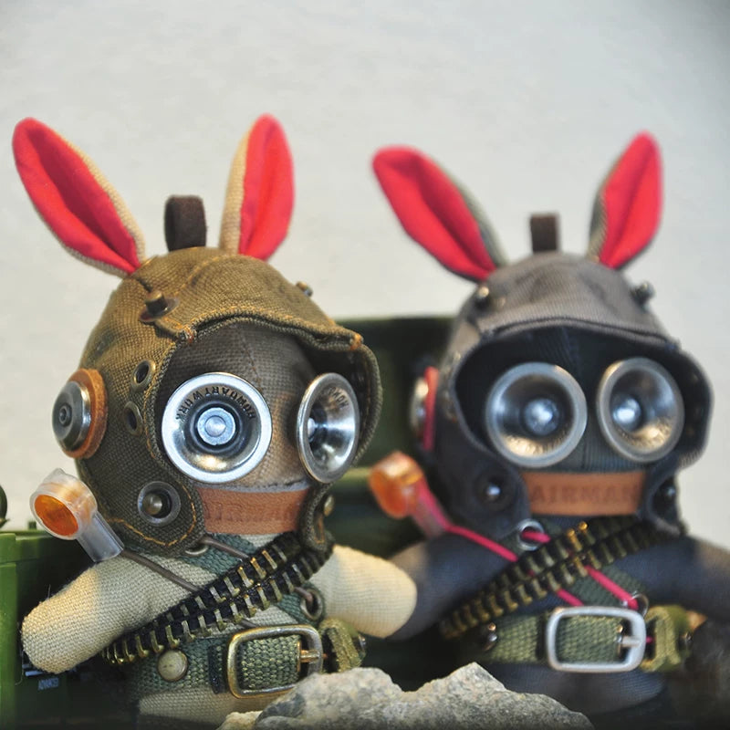 Tac-bunny soldier wearing black tactical suit and armored helmet. Dark military aesthetic, gothic artisan art toy, macabre collectible.