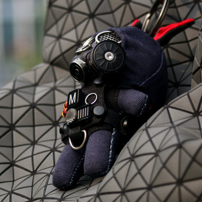 Gothic dark bunny with detailed gas mask apparatus and quilted tactical jacket. Macabre artisan art toy, designer keychain.
