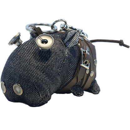 Denim hippo featuring indigo body and weathered brass-tone hardware details. Gothic artisan craft, dark folk art keychain.