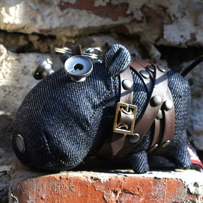 Rustic artisan denim hippo figure with blue-gray fabric and leather tag accent. Gothic folk art style, dark macabre collectible.