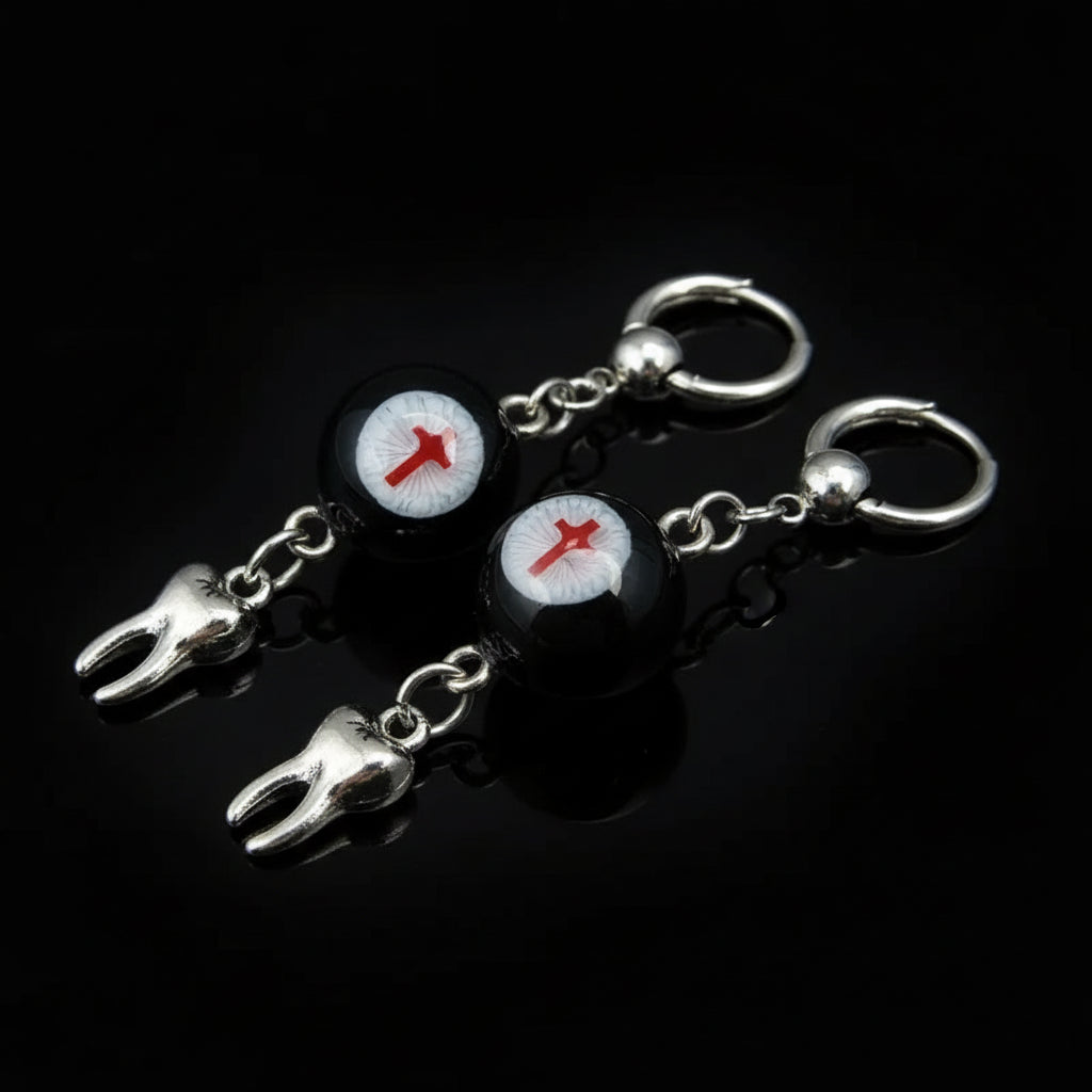 Gothic crimson cross faux eyeball tooth charm drop earrings on solid black background