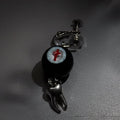 Single gothic crimson cross faux eyeball tooth charm drop earring on grey background