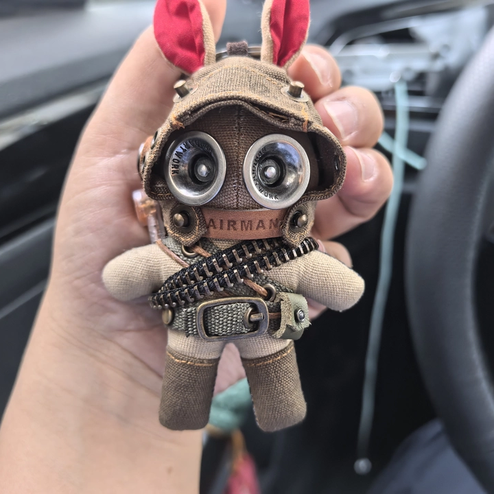 Tactical bunny soldiers with goggled helmets and military hardware. Dark post-apocalyptic aesthetic, gothic artisan art toy collectible.